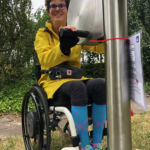 exercises on the playfit Arm Cycle K05035 in a park with safety surfacing