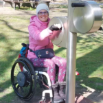 uses the playfit Arm Cycle K05035 in an outdoor fitness park